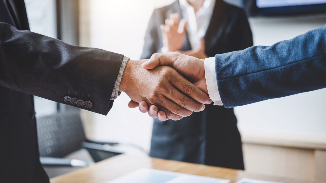 Finishing up a meeting, Business shaking hands after discussing good deal of Trading to sign agreement and become a partner, contract for both companies, Successful businessman handshake.