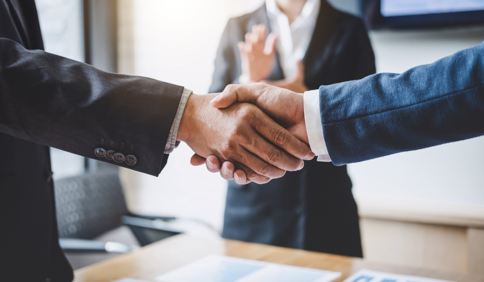 Finishing up a meeting, Business shaking hands after discussing good deal of Trading to sign agreement and become a partner, contract for both companies, Successful businessman handshake.